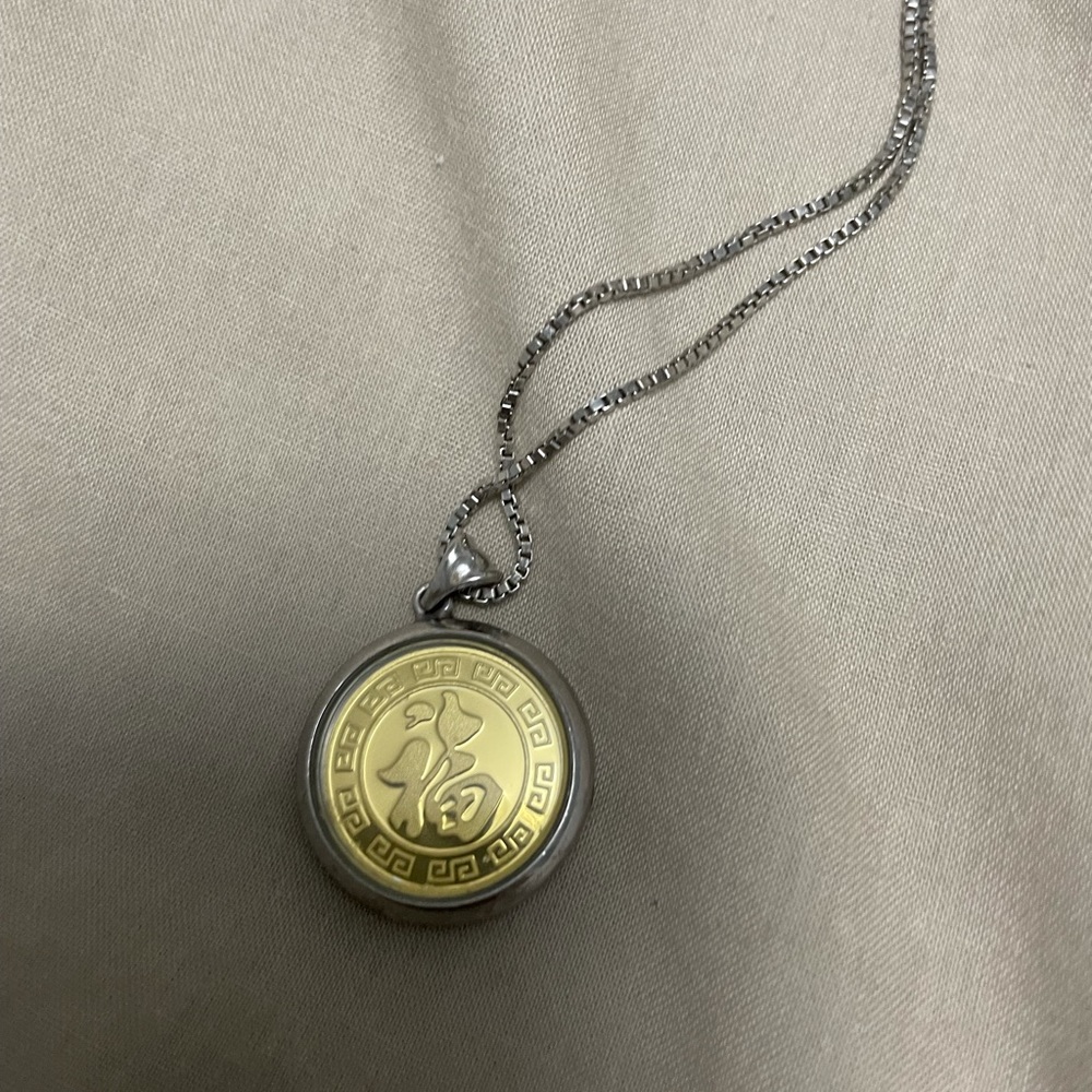 Brand is HQ it’s sterling silver and gold